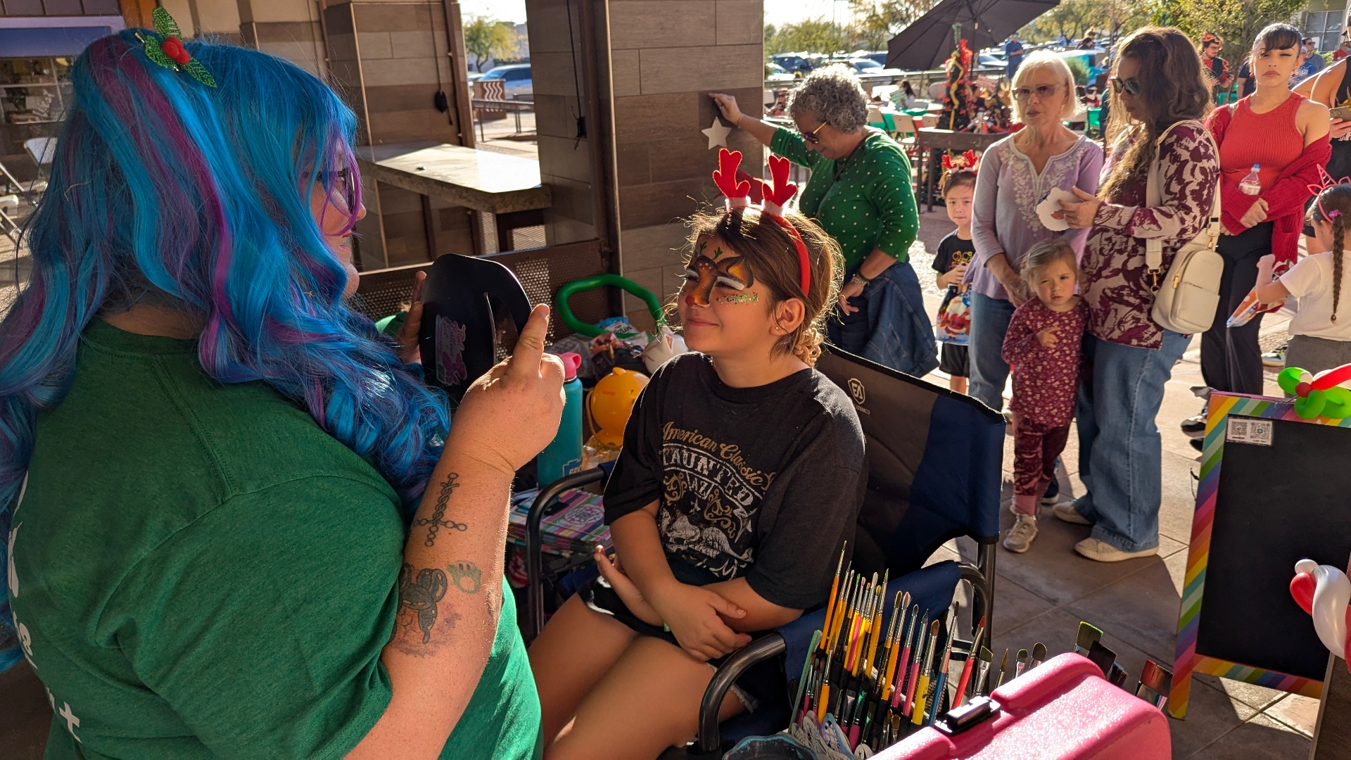 Face painting bringing energy and family activity to a shopping center event